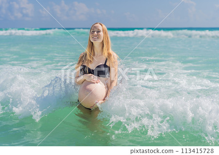 In the idyllic embrace of the Caribbean Sea, a pregnant woman finds bliss, savoring the warmth and serenity of the tropical waters during her pregnancy In the idyllic embrace of the Caribbean Sea, a pregnant woman finds bliss, savoring the warmth and serenity of the tropical waters during her pregnancy 113415728