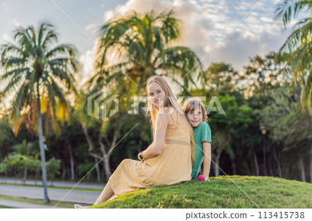 Heartwarming outdoor bonding as a pregnant mom and her son enjoy quality time together, savoring the beauty of nature and creating cherished moments Heartwarming outdoor bonding as a pregnant mom and her son enjoy quality time together, savoring the beauty of nature and creating cherished moments 113415738