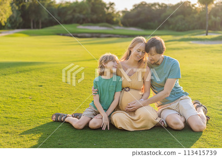 Joyful family time as a pregnant woman, her husband, and son share quality moments outdoors, embracing the beauty of nature and creating cherished memories together Joyful family time as a pregnant woman, her husband, and son share quality moments outdoors, embracing the beauty of nature and creating cherished memories together 113415739