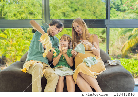 Heartwarming family moment as expectant mom, dad, and son joyfully browse through newborn baby's clothes, eagerly anticipating the arrival of a new family member Heartwarming family moment as expectant mom, dad, and son joyfully browse through newborn baby's clothes, eagerly anticipating the arrival of a new family member 113415816