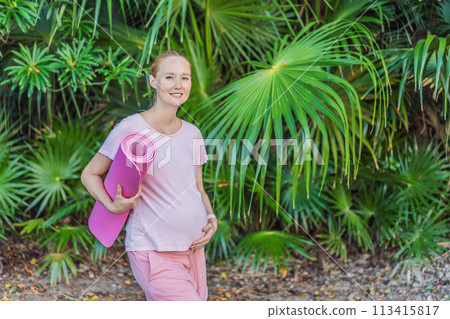 Energetic pregnant woman takes her workout outdoors, using an exercise mat for a refreshing and health-conscious outdoor exercise session Energetic pregnant woman takes her workout outdoors, using an exercise mat for a refreshing and health-conscious outdoor exercise session 113415817