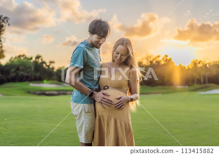A blissful moment as a pregnant woman and her husband spend quality time together outdoors, savoring each other's company and enjoying the serenity of nature 113415882