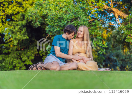 Pregnant woman and her husband spend quality time together outdoors, savoring each other's company and enjoying the serenity of nature 113416039