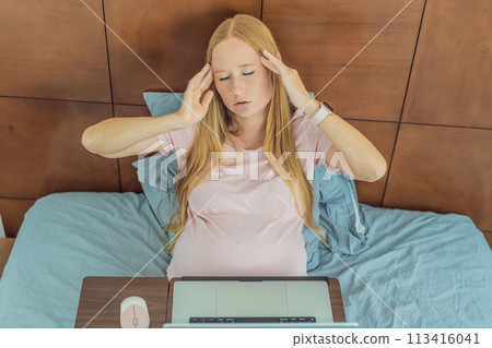 Weary pregnant woman, tired of working from home, navigates the challenges of balancing professional tasks with pregnancy demands Weary pregnant woman, tired of working from home, navigates the challenges of balancing professional tasks with pregnancy demands 113416041