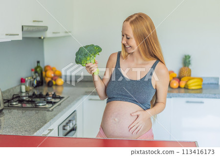 Embracing a nutrient-rich choice, a pregnant woman eagerly prepares to enjoy a wholesome serving of broccoli, prioritizing healthy and nourishing options during her pregnancy 113416173