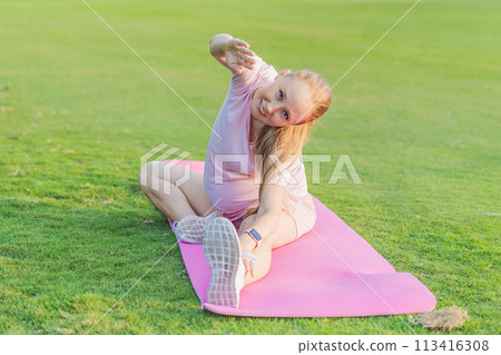 Energetic pregnant woman takes her workout outdoors, using an exercise mat for a refreshing and health-conscious outdoor exercise session Energetic pregnant woman takes her workout outdoors, using an exercise mat for a refreshing and health-conscious outdoor exercise session 113416308