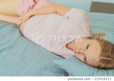 Sleep-deprived pregnant woman struggles with insomnia, navigating the challenges of restlessness during pregnancy 113416311