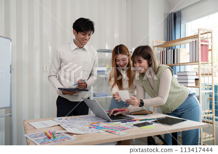 Brainstorm team of creative web graphic designer planning. Creative designers present ux ui to team. Designers team working meeting in office 113417444