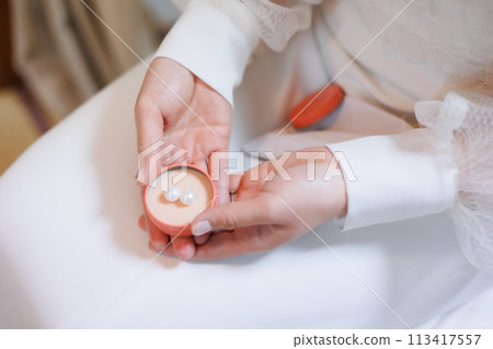 Bride with earrings Bride with earrings 113417557