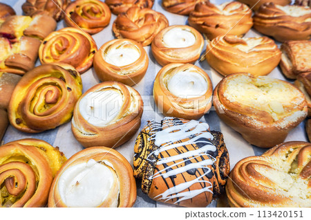 Showcase with different fresh sweet cakes Showcase with different fresh sweet cakes 113420151