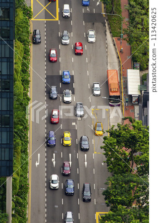 Downtown, Singapore - June 13, 2023 : Aerial View Of Traffic On A Large Street In Downtown Singapore. Downtown, Singapore - June 13, 2023 : Aerial View Of Traffic On A Large Street In Downtown Singapore. 113420625