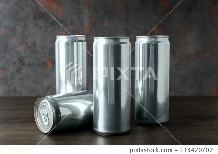 Tin cans for drinks on a dark background Tin cans for drinks on a dark background 113420707