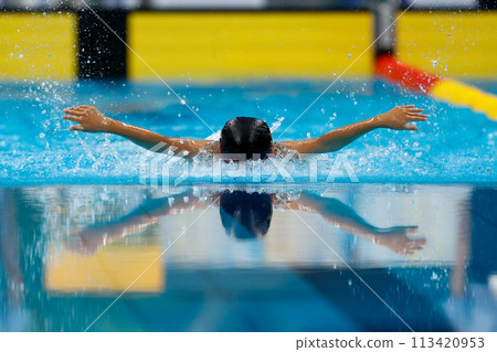 Swimming competition, butterfly stroke athlete Swimming competition, butterfly stroke athlete 113420953