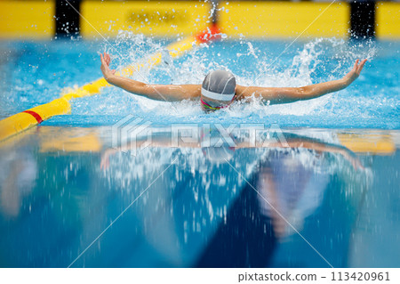 Swimming competition, butterfly stroke athlete Swimming competition, butterfly stroke athlete 113420961