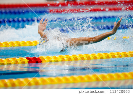 Swimming competition, butterfly stroke athlete Swimming competition, butterfly stroke athlete 113420963