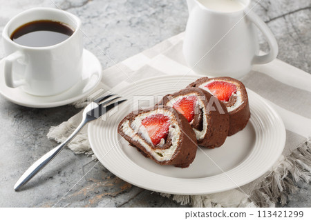 Chocolate cake roll with fresh strawberries and cream cheese closeup on. Horizontal 113421299