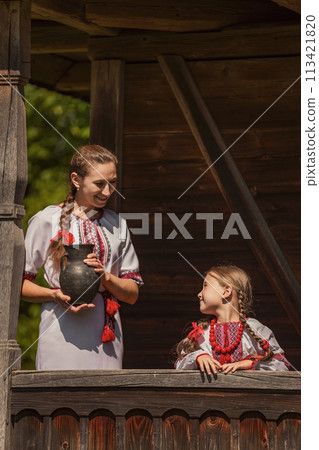 mother and daughter dressed in Ukrainian national costumes mother and daughter dressed in Ukrainian national costumes 113421820