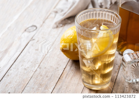 Highball, Whiskey with soda and lemon beverage on wooden table 113423872