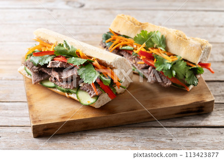 Vietnamese banh mi sandwich on wooden table 113423877