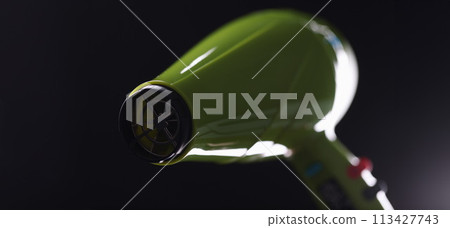 Green modern trendy hair dryer on gray background 113427743