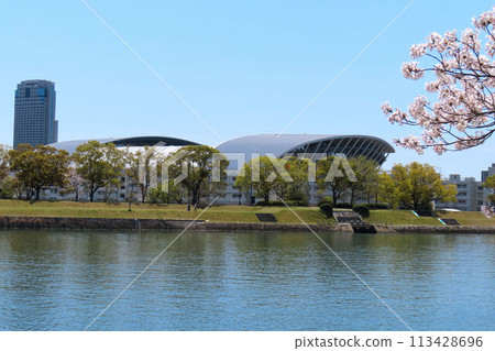 View of EDION Peace Wing Hiroshima and cherry blossoms from the opposite bank of Honkawa (formerly Otagawa River) View of EDION Peace Wing Hiroshima and cherry blossoms from the opposite bank of Honkawa (formerly Otagawa River) 113428696