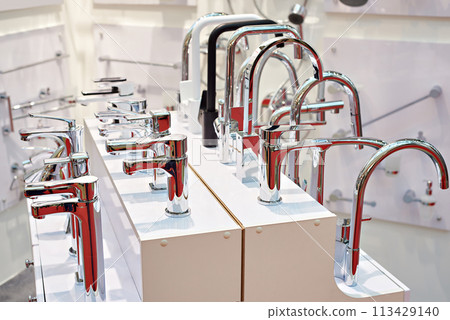 Modern water faucets in store 113429140