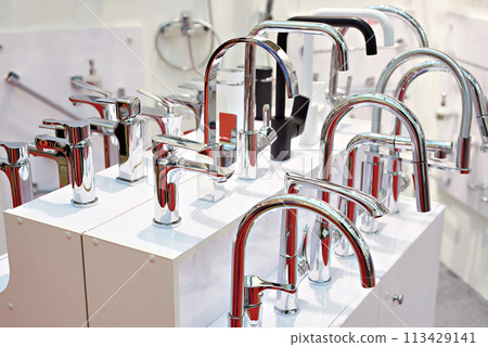 Modern water faucets in store 113429141