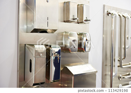 Napkin boxes and soap dispensers in store of toilets goods 113429198