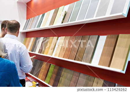 Paint samples on wooden panels in store 113429262