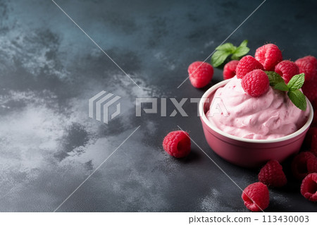 Pink raspberry yogurt in white cups against a grey background. Pink raspberry yogurt in white cups against a grey background. 113430003
