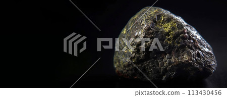 Mathesiusite fossil mineral stone. Geological crystalline fossil. Dark background close-up. Mathesiusite fossil mineral stone. Geological crystalline fossil. Dark background close-up. 113430456
