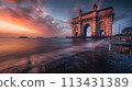 Mumbai. The stone arch of India's Gateway shines at sunrise with the Arabian Sea in view 113431389