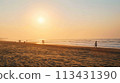 Mumbai. Joggers and yoga enthusiasts embrace peaceful Juhu Beach sunrise 113431390