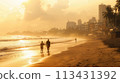 Mumbai. Early hours at Juhu Beach: tranquil yoga, joggers, vast sands, rising sun 113431392