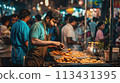 Mumbai. Busy street scene: vada pav prepared for an eager crowd in Mumbai 113431395