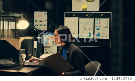 Law agent compares witness statements and interviews across investigations, trying to find similarities with archived files. Detective searches for connections between unrelated cases. Camera A. Law agent compares witness statements and interviews across investigations, trying to find similarities with archived files. Detective searches for connections between unrelated cases. Camera A. 113433780