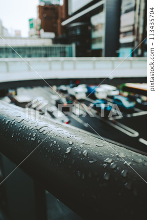 Raindrops on a pedestrian bridge, Shibuya Station East Exit Intersection, Tokyo 2024.04 b-4 Film-like 113435704