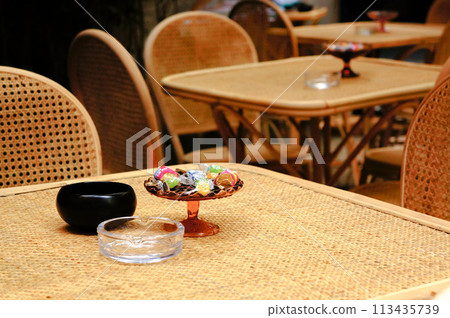 Ashtray and candy on the terrace Ashtray and candy on the terrace 113435739