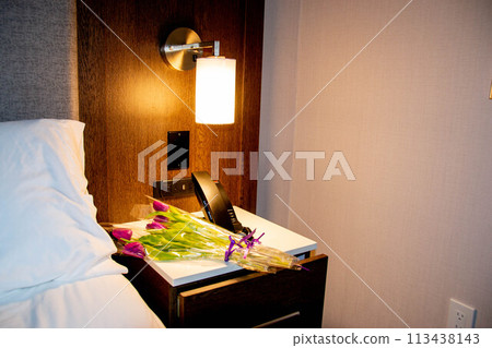 Flowers tulips pink with bright green stems and leaves on a blue background. Flowers tulips pink with bright green stems and leaves on a blue background. 113438143