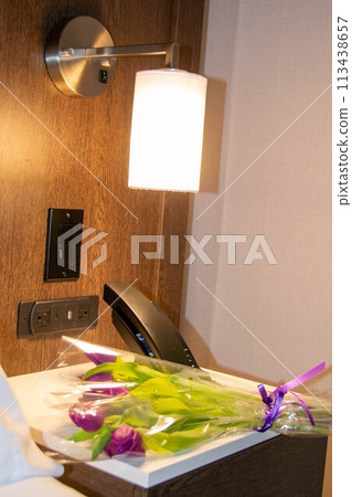 Flowers tulips pink with bright green stems and leaves on a blue background. 113438657