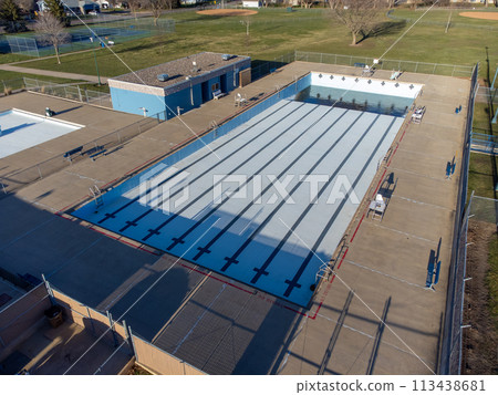 Drone view of an empty and drained winterized swimming pool  113438681