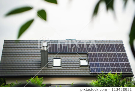House roof with photovoltaic modules. House roof with photovoltaic modules. 113438931