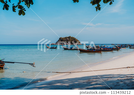 Wooden boat on the beach on the island Wooden boat on the beach on the island 113439212
