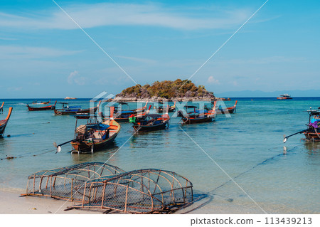 Wooden boat on the beach on the island Wooden boat on the beach on the island 113439213