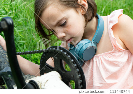 Young girl cyclist enjoy the beautiful sunrise on summer forest trail 113440744
