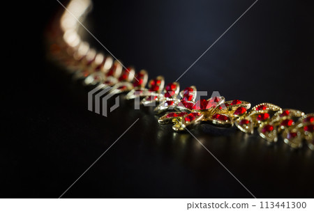 Gold necklace closeup 113441300