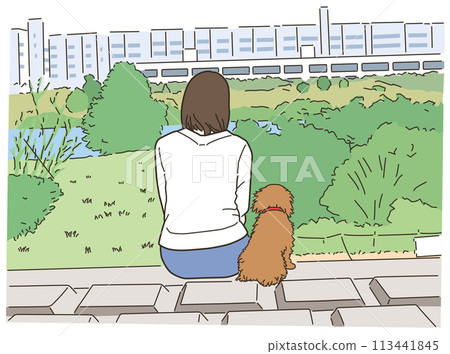 Woman sitting outdoors in nature with her pet dog 113441845