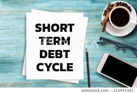 Business quotes, SHORT TERM DEBT CYCLE on notebooks or paper in office desk, office workplace Business quotes, SHORT TERM DEBT CYCLE on notebooks or paper in office desk, office workplace 113441881