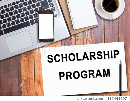 Business quotes, SCHOLARSHIP PROGRAM on notebook or paper in office desk, office workplace 113441897
