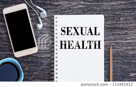 Business quotes, SEXUAL HEALTH on notebook or paper in office desk, office workplace Business quotes, SEXUAL HEALTH on notebook or paper in office desk, office workplace 113441912